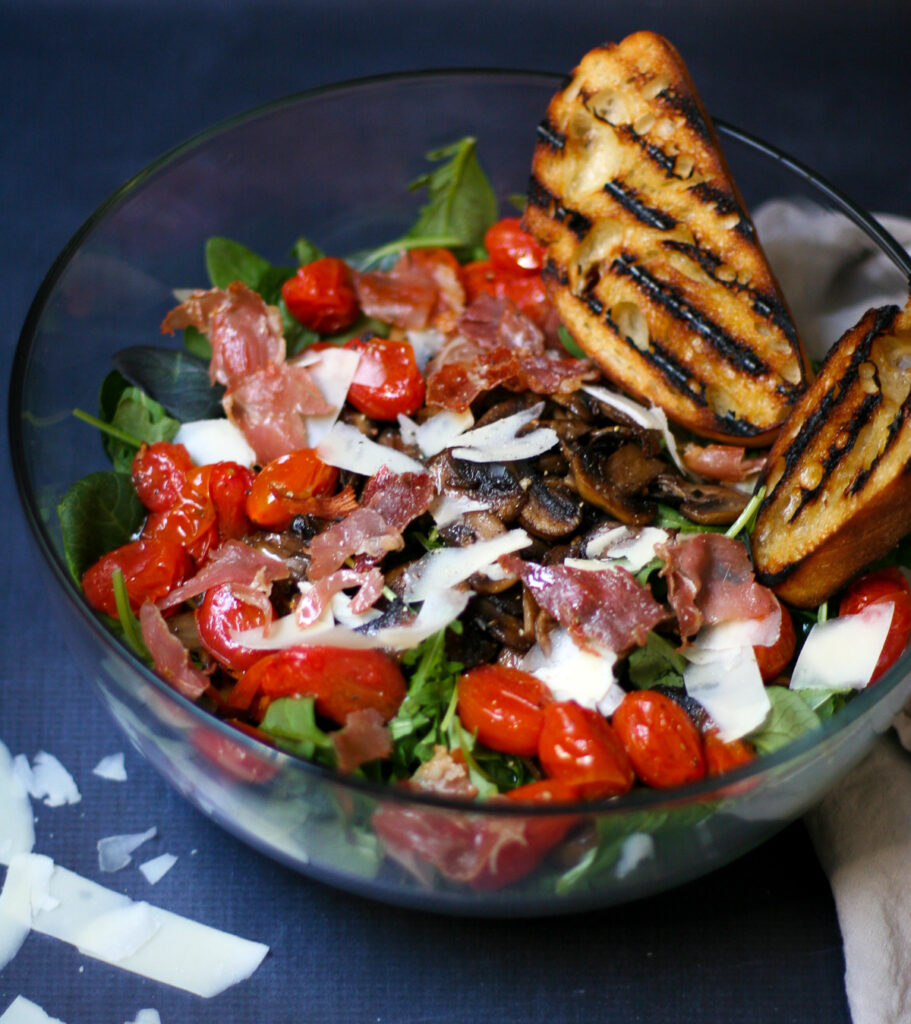 Sautéed Mushroom Salad with Crispy Prosciutto, Blistered Tomatoes, and Gruyere